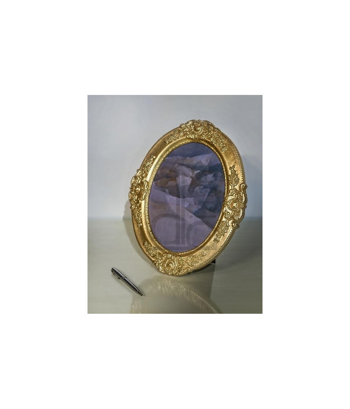 portafoto in foglia oro ovale- Misure: l.32 x h.38 x p.2